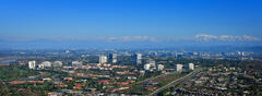 Skyline of Irvine  with snow/ mountains