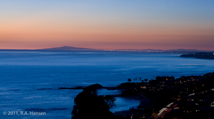 This expansive view on a clear evening shows the coastline all the way to the distant Palos Verdes peninsula, which is silhouetted...