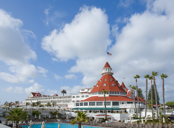 Iconic view of the main building, guest wing, and pool of this historic hotel