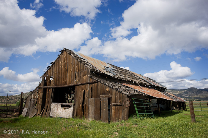 This decrepit shell stands in stark contrast to the blue sky and clouds above