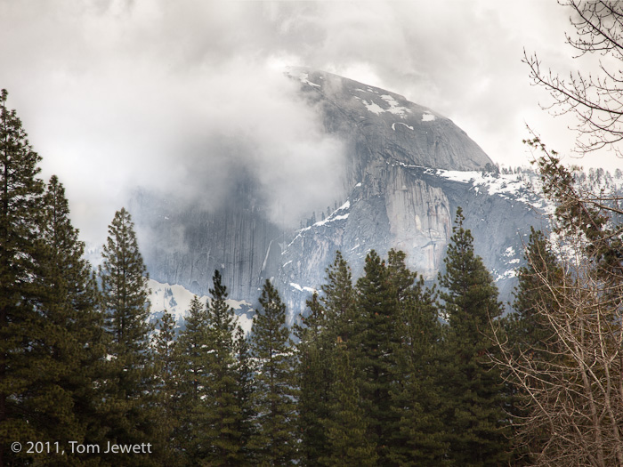 Unlike most views of this iconic Yosemite landmark, a winter afternoon shows it half-hidden by low clouds. Photo by Tom Jewett...