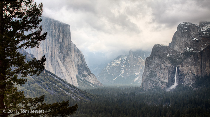 Winter low clouds hang over the valley in this image from the Tunnel View overlook, obscuring background features like Half Dome...