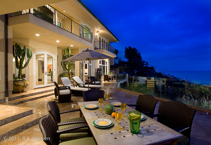 Patio dining at an elegant residence with ocean view. For more residential and commercial architecture images, please visit Robert...