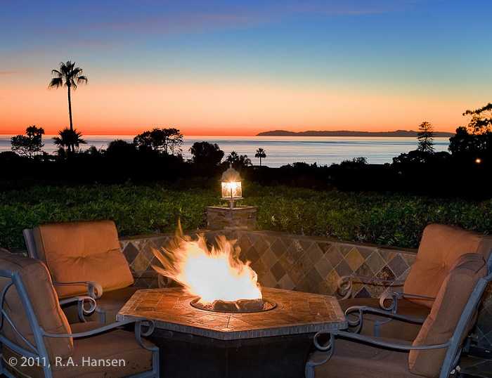 Evening by the fire pit an an elegant residence. For more residential and commercial architecture images, please visit Robert...