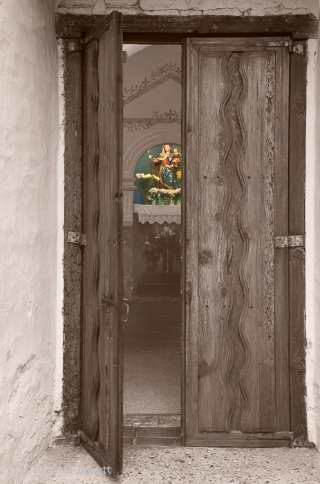 The Open Door -- Looking from the garden into the nave just in front of the sanctuary; the niche on the far side wall holds a...